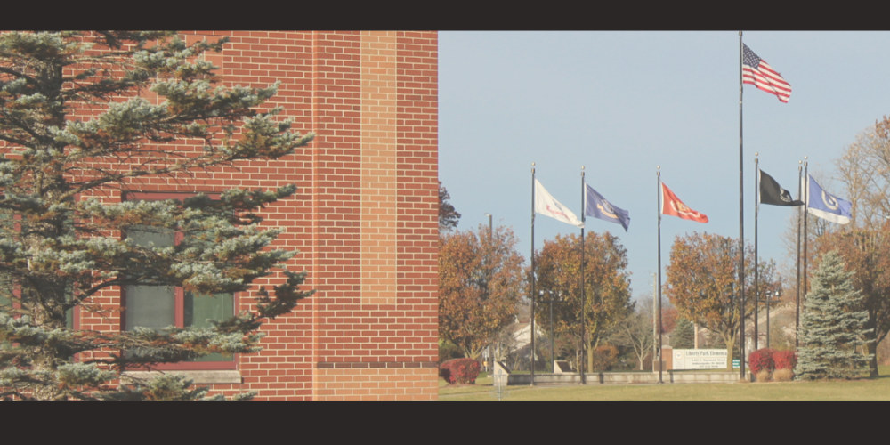 Image of Raymond Park with flags