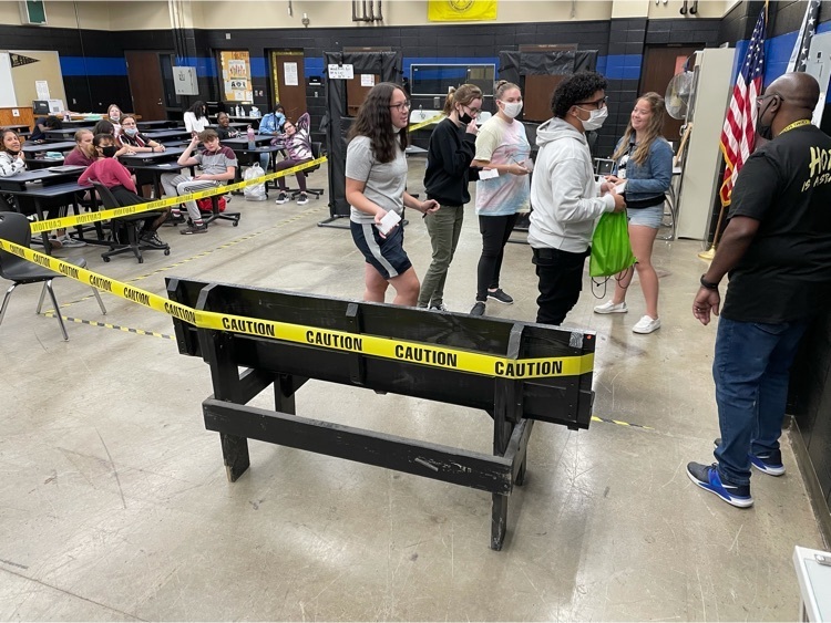Students investigating a crime scene in Criminal Justice