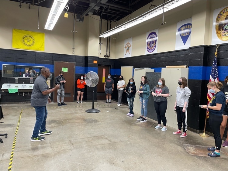Criminal Justice Students learning handcuffing techniques
