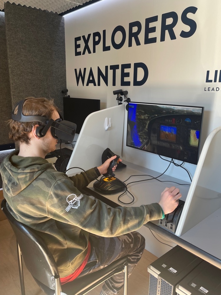 A student gets to try his hand at flying on a virtual flight simulator.
