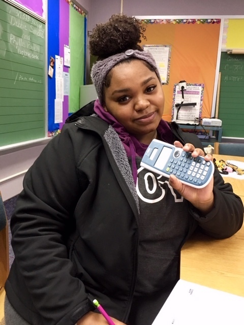 Student practicing with the calculator